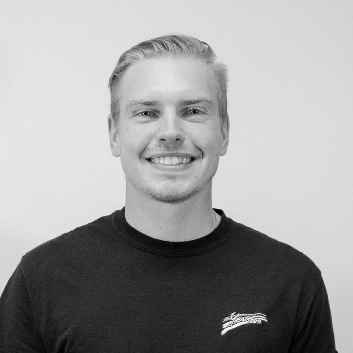 Dima Matyushenko Smiling man with short hair wearing a dark t-shirt. The image is in black and white, conveying a friendly and approachable tone.